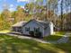 Side view of the home's exterior, with manicured lawn and landscape at 11404 Leesville Rd, Raleigh, NC 27613