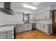Modern kitchen with stainless steel appliances, white cabinetry, countertops and backsplash at 11404 Leesville Rd, Raleigh, NC 27613