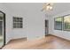 Cozy living room featuring hardwood floors and a ceiling fan with a view to an adjacent room at 11404 Leesville Rd, Raleigh, NC 27613