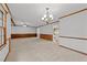 This bonus room boasts carpeted floors, wood-paneled walls, and great lighting at 11404 Leesville Rd, Raleigh, NC 27613