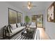 This sun room has great natural light, stylish furniture, and wood flooring at 11404 Leesville Rd, Raleigh, NC 27613