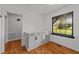 Bright office space features a built in storage unit and hardwood flooring with natural light at 11404 Leesville Rd, Raleigh, NC 27613