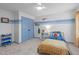 Cozy bedroom with a comfortable bed, blue accents, and a well-lit interior at 120 Wellspring Dr, Holly Springs, NC 27540