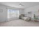 Bright bedroom with neutral carpet, bunk beds, and a large window at 120 Wellspring Dr, Holly Springs, NC 27540