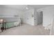 Bedroom featuring light colored carpet, bunkbeds, closet and ensuite entrance at 120 Wellspring Dr, Holly Springs, NC 27540