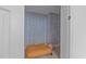 Cozy closet featuring patterned wallpaper, soft lighting, and a comfortable ottoman at 120 Wellspring Dr, Holly Springs, NC 27540