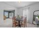 Bright dining room featuring round table, wood chairs, and abundant natural light at 120 Wellspring Dr, Holly Springs, NC 27540
