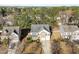 Two-story home featuring a gray roof, brick facade, manicured landscaping, and a two-car garage at 120 Wellspring Dr, Holly Springs, NC 27540