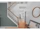 Spacious foyer with hardwood floors, staircase, and ample natural light at 120 Wellspring Dr, Holly Springs, NC 27540