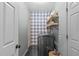 Functional laundry room with stylish buffalo check wallpaper and modern appliances at 120 Wellspring Dr, Holly Springs, NC 27540