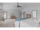 Large bedroom featuring ensuite bathroom, neutral paint, and multiple storage options at 120 Wellspring Dr, Holly Springs, NC 27540