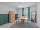 Home office featuring stylish grid wallpaper, a wooden desk, and comfortable seating at 120 Wellspring Dr, Holly Springs, NC 27540