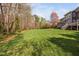 Expansive lawn behind this beautiful home, surrounded by a wooded area at 1204 Croydon Glen Ct, Cary, NC 27519