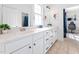Bright bathroom with double vanity, tile flooring, and modern fixtures at 1204 Croydon Glen Ct, Cary, NC 27519