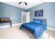 Blue bedroom featuring an aquarium and neutral carpeting at 1204 Croydon Glen Ct, Cary, NC 27519