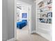 Bright bedroom adjacent to an alcove with built-in shelving at 1204 Croydon Glen Ct, Cary, NC 27519