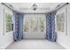 Sunlit bedroom featuring ample windows and decorative curtains at 1204 Croydon Glen Ct, Cary, NC 27519