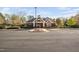 Exterior of community clubhouse with parking and a gated entrance at 1204 Croydon Glen Ct, Cary, NC 27519