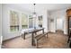 Dining room featuring a rustic wooden table and large windows at 1204 Croydon Glen Ct, Cary, NC 27519