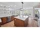 Kitchen with a large island and stainless steel dishwasher at 1204 Croydon Glen Ct, Cary, NC 27519