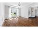 An empty living room featuring hardwood floors and large windows at 1204 Croydon Glen Ct, Cary, NC 27519