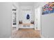 Inviting mudroom with bench seating and storage, complemented by bright, airy decor at 1204 Croydon Glen Ct, Cary, NC 27519