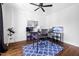 Office space featuring hardwood floors, built-in shelves, and a window providing natural light and street views at 1204 Croydon Glen Ct, Cary, NC 27519