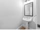 Elegant powder room with pedestal sink and classic fixtures at 1204 Croydon Glen Ct, Cary, NC 27519