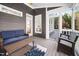 Cozy screened porch with stylish wicker furniture, a ceiling fan and pleasant outdoor views at 1204 Croydon Glen Ct, Cary, NC 27519