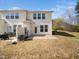 Backyard featuring patio, green space, and the home's exterior at 1220 Falcon Ridge Ln, Morrisville, NC 27560