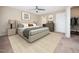 Serene bedroom featuring a king-sized bed, soft carpeting, and an en-suite bathroom at 1220 Falcon Ridge Ln, Morrisville, NC 27560