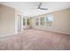 Spacious bedroom with large windows and neutral carpeting, offering plenty of natural light at 1220 Falcon Ridge Ln, Morrisville, NC 27560