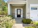 Close-up of the home's front porch with decorative stone, trim and the house number 1220 at 1220 Falcon Ridge Ln, Morrisville, NC 27560
