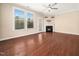 Bright living room with large windows, hardwood floors and a fireplace at 1220 Falcon Ridge Ln, Morrisville, NC 27560
