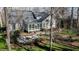 Aerial view showcasing home with sunroom, pond and patio area at 1229 Westerham Dr, Wake Forest, NC 27587
