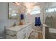 Bathroom with a marble countertop, modern vanity, and glass-enclosed walk-in shower at 1229 Westerham Dr, Wake Forest, NC 27587
