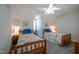 Bright bedroom with two twin beds and ceiling fan at 1229 Westerham Dr, Wake Forest, NC 27587