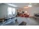 Finished room with neutral carpet, ceiling fan, and seating area by the window at 1229 Westerham Dr, Wake Forest, NC 27587