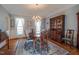 Charming dining room with hardwood floors, large window and chandelier at 1229 Westerham Dr, Wake Forest, NC 27587