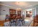 Dining room with hardwood floors, chandelier and view of the kitchen at 1229 Westerham Dr, Wake Forest, NC 27587