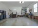 Clean and well-lit garage with storage solutions and a side entrance for convenience at 1229 Westerham Dr, Wake Forest, NC 27587