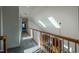 Hallway featuring skylights, and stairs to a lower level at 1229 Westerham Dr, Wake Forest, NC 27587
