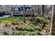 Beautiful home exterior with blooming flowers and lush greenery at 1229 Westerham Dr, Wake Forest, NC 27587