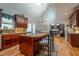 Open-concept kitchen with central island, stainless appliances, and a view into the adjacent living space at 1229 Westerham Dr, Wake Forest, NC 27587