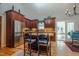 Gourmet kitchen featuring stainless steel appliances, central island, and a sunny view from an adjacent door at 1229 Westerham Dr, Wake Forest, NC 27587