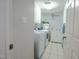 Well-equipped laundry room with modern appliances and ample cabinet space at 1229 Westerham Dr, Wake Forest, NC 27587