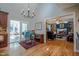 Open-concept living room and dining room with hardwood floors and fireplace at 1229 Westerham Dr, Wake Forest, NC 27587