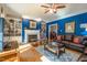 Comfortable living room with hardwood floors, fireplace, built-in bookshelves, and an area rug at 1229 Westerham Dr, Wake Forest, NC 27587