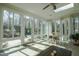 Sunroom features tile flooring, a ceiling fan, a skylight and walls of windows overlooking the patio at 1229 Westerham Dr, Wake Forest, NC 27587