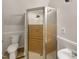 This bathroom features a glass-enclosed shower, a toilet, and a sink with gray walls at 129 Bridges Ln, Youngsville, NC 27596